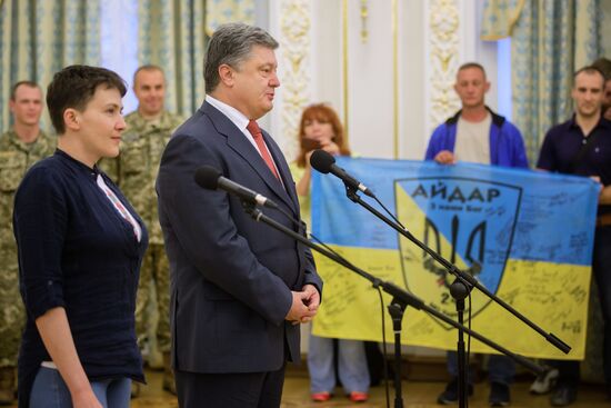 Ukrainian President Petro Poroshenko awards Nadezhda Savchenko the Order of Gold Star