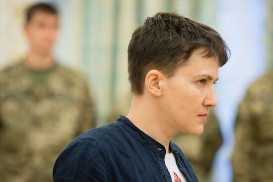 Ukrainian President Petro Poroshenko awards Nadezhda Savchenko the Order of Gold Star