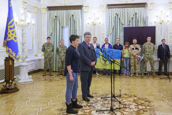Ukrainian President Petro Poroshenko awards Nadezhda Savchenko the Order of Gold Star