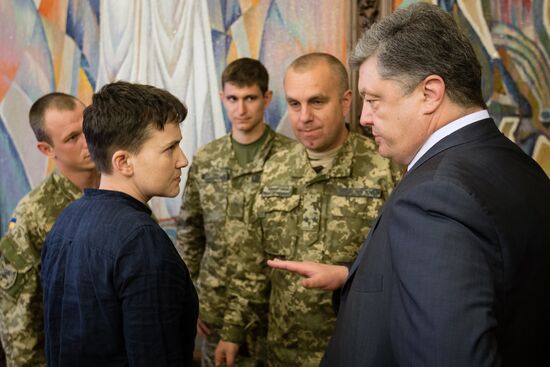 Ukrainian President Petro Poroshenko awards Nadezhda Savchenko the Order of Gold Star