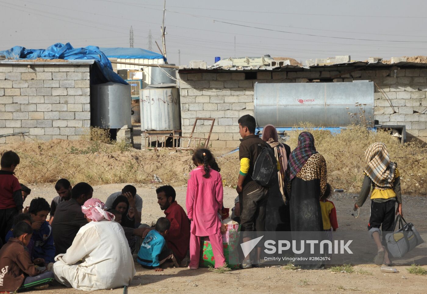 Refugees from ISIL-occupied lands come to Kirkuk in Iraq