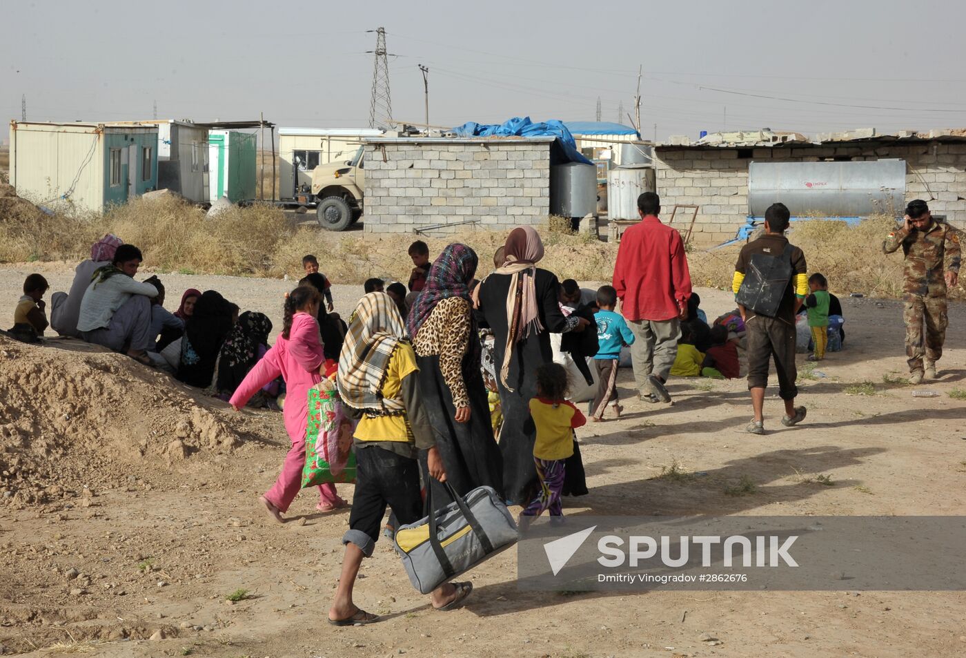 Refugees from ISIL-occupied lands come to Kirkuk in Iraq
