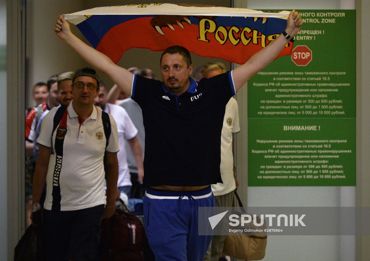 Russian football fans return from France