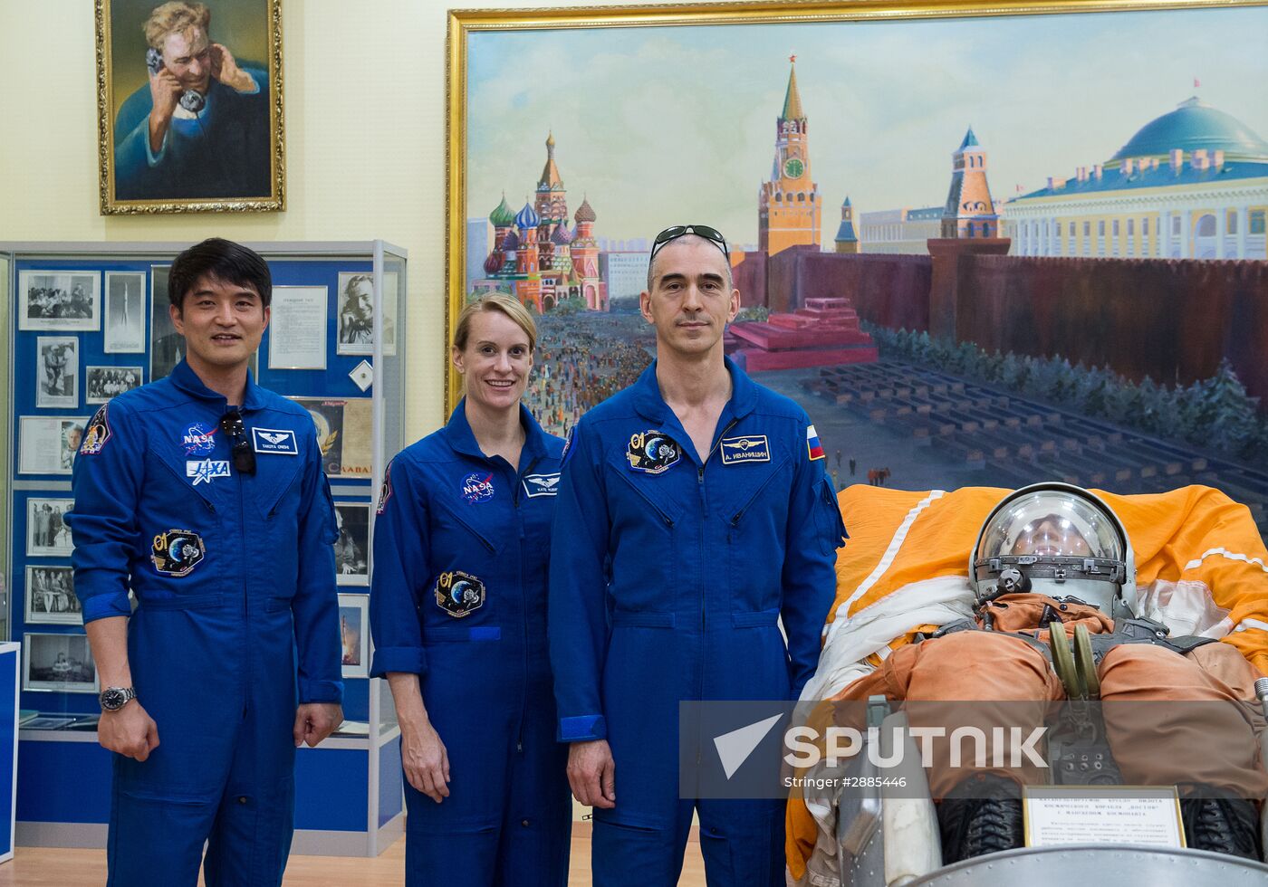 ISS Expedition 48/49 crew examines vessel