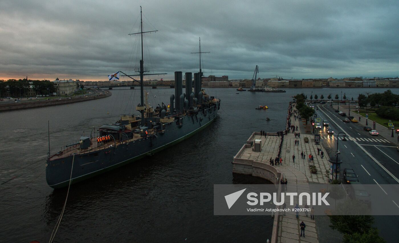 Cruiser Aurora towed to permanent mooring at Petrovskaya Embankment