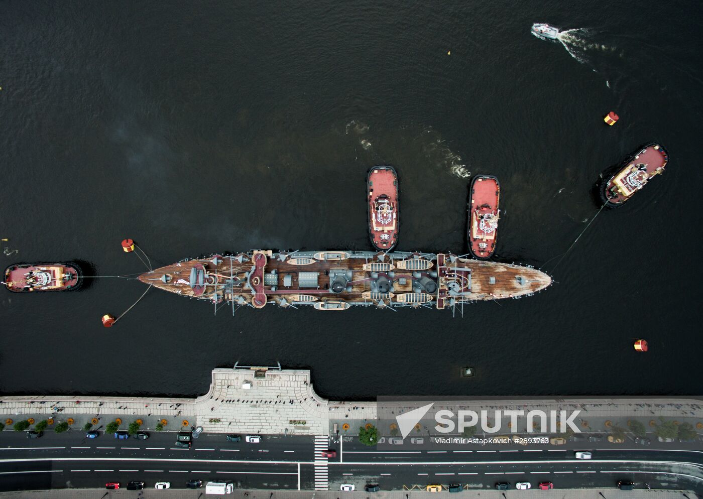Cruiser Aurora towed to permanent mooring at Petrovskaya Embankment