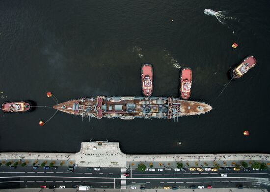 Cruiser Aurora towed to permanent mooring at Petrovskaya Embankment