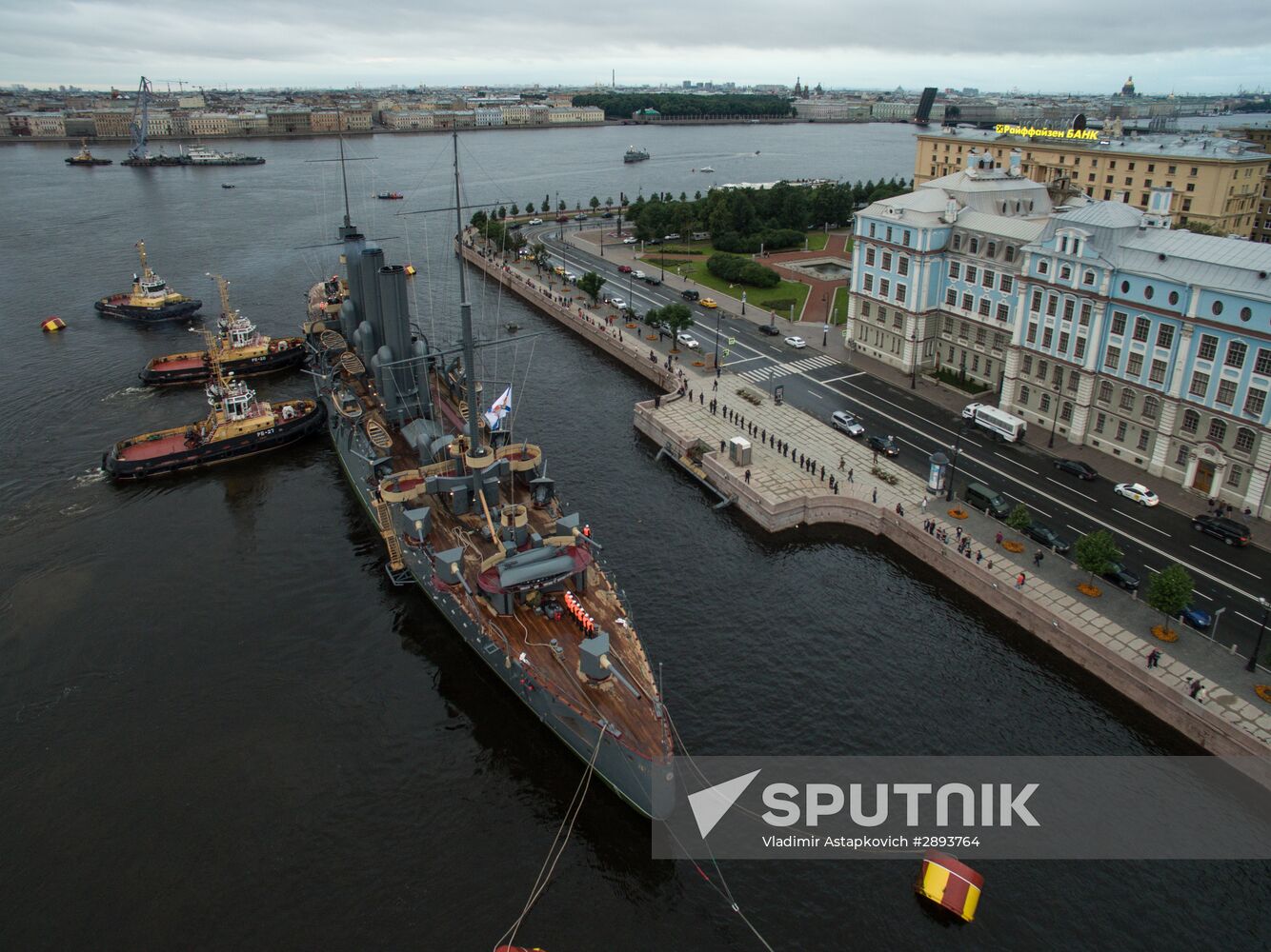 Cruiser Aurora towed to permanent mooring at Petrovskaya Embankment