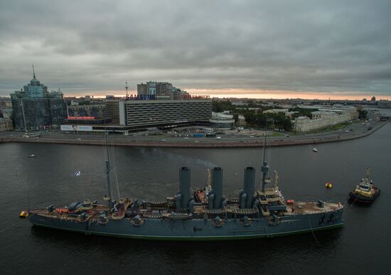 Cruiser Aurora towed to permanent mooring at Petrovskaya Embankment
