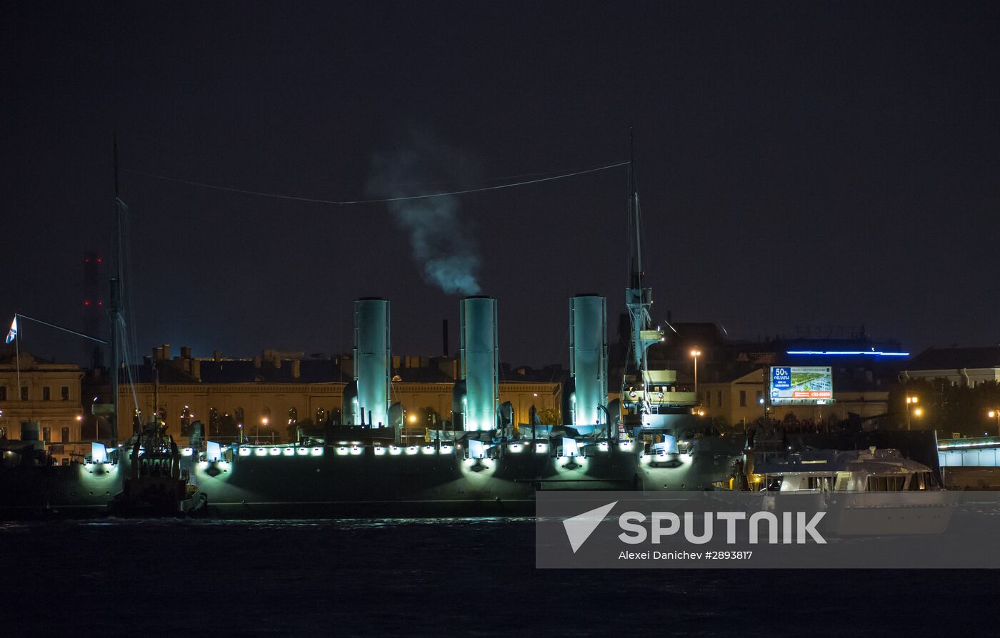 Cruiser Aurora towed to permanent mooring at Petrovskaya Embankment