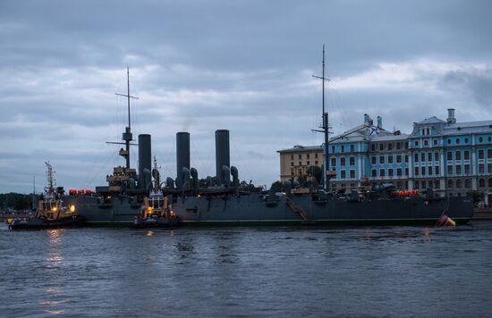 Cruiser Aurora towed to permanent mooring at Petrovskaya Embankment