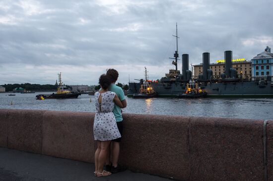 Cruiser Aurora towed to permanent mooring at Petrovskaya Embankment