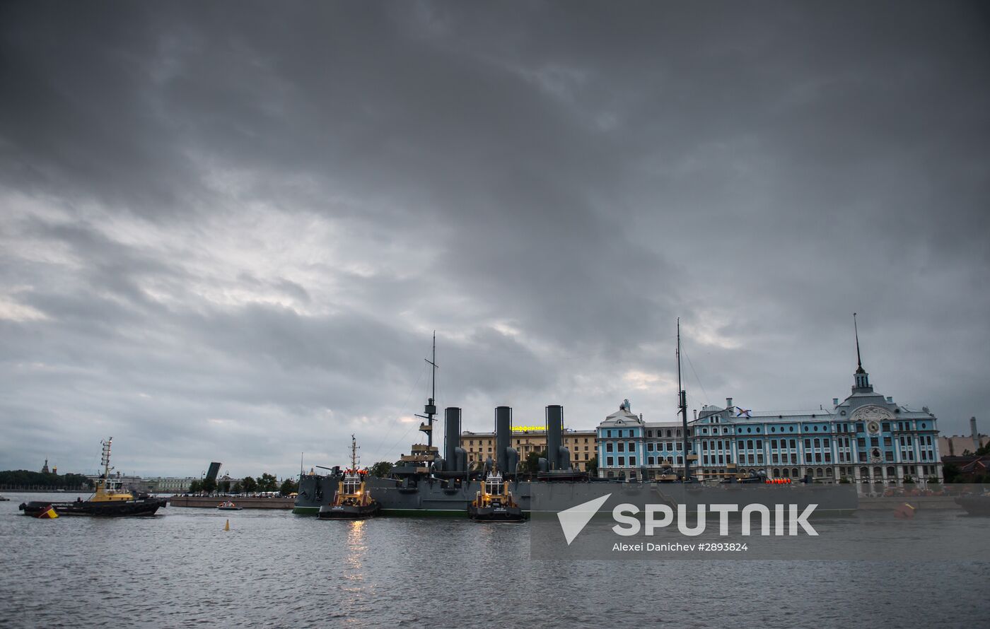 Cruiser Aurora towed to permanent mooring at Petrovskaya Embankment