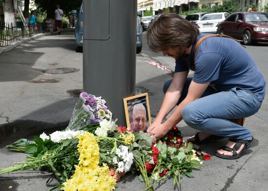 Flowers and candles on the site of murder of journalist Pavel Sheremet in Kiev