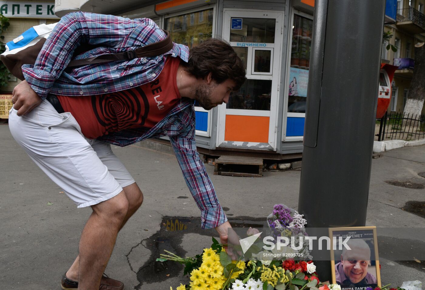 Flowers and candles on the site of murder of journalist Pavel Sheremet in Kiev