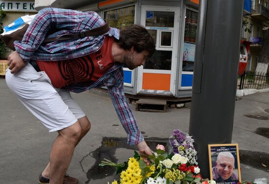 Flowers and candles on the site of murder of journalist Pavel Sheremet in Kiev