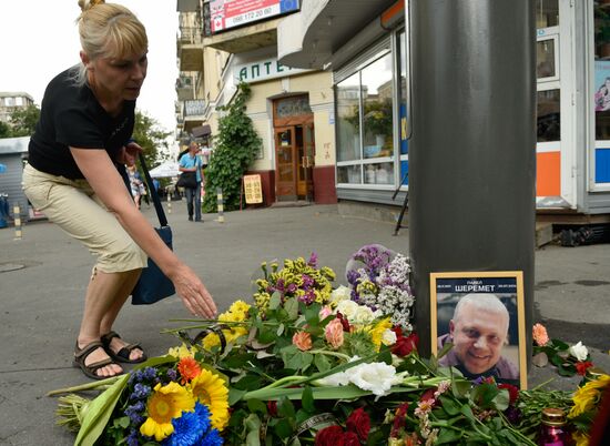 Flowers and candles on the site of murder of journalist Pavel Sheremet in Kiev