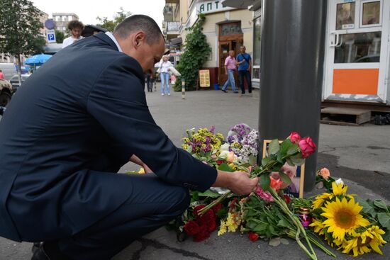 Flowers and candles on the site of murder of journalist Pavel Sheremet in Kiev