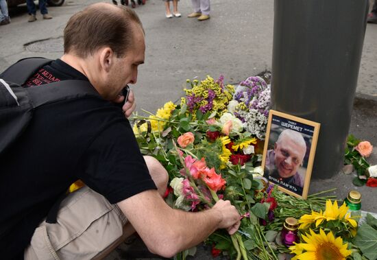 Flowers and candles on the site of murder of journalist Pavel Sheremet in Kiev