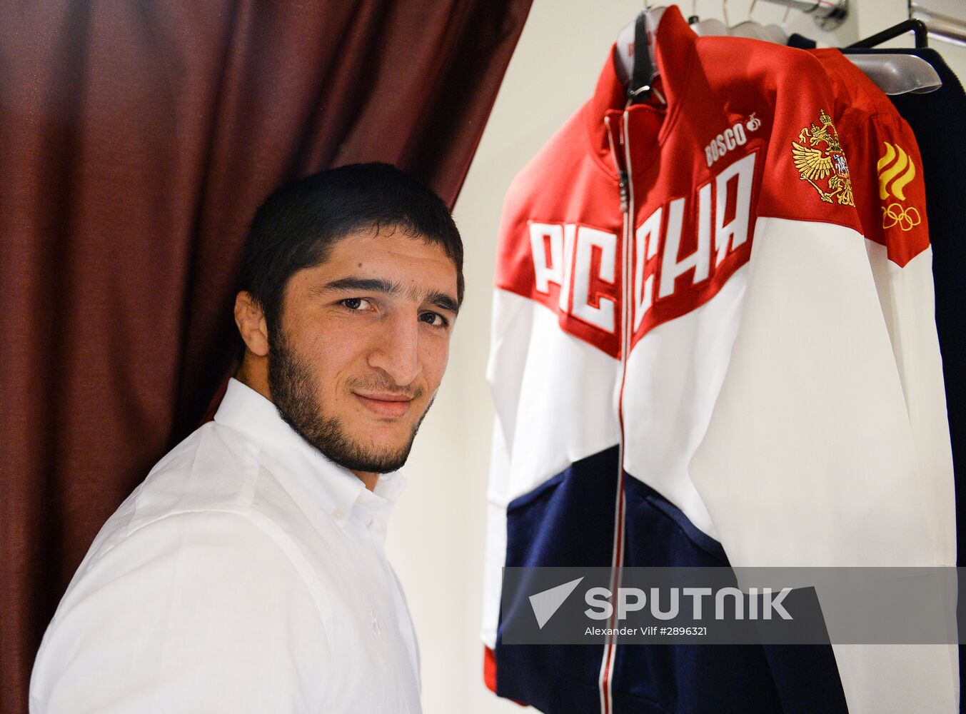 Russian Olympic track and field and freestyle wrestling teams receive outfits for 2016 Olympics