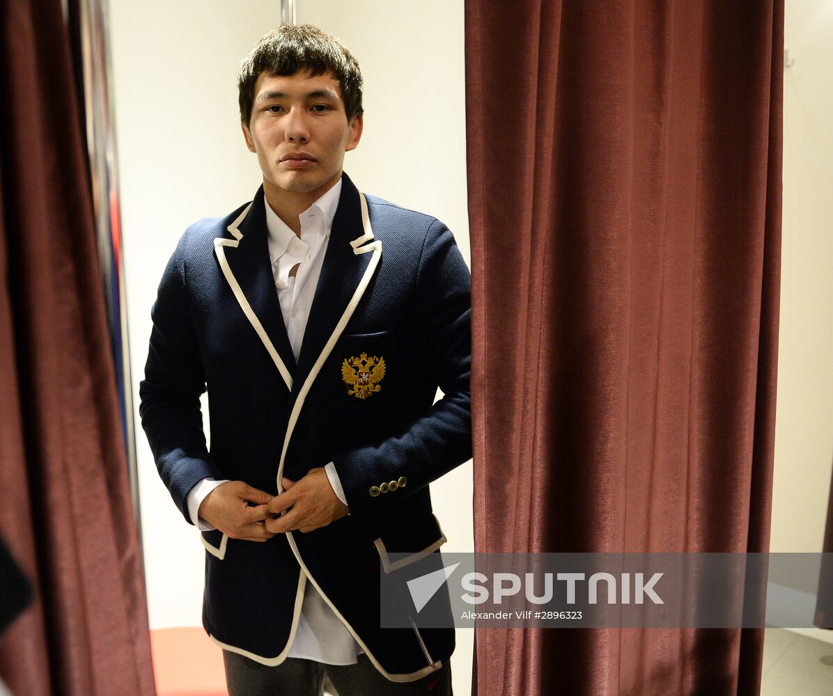 Russian Olympic track and field and freestyle wrestling teams receive outfits for 2016 Olympics