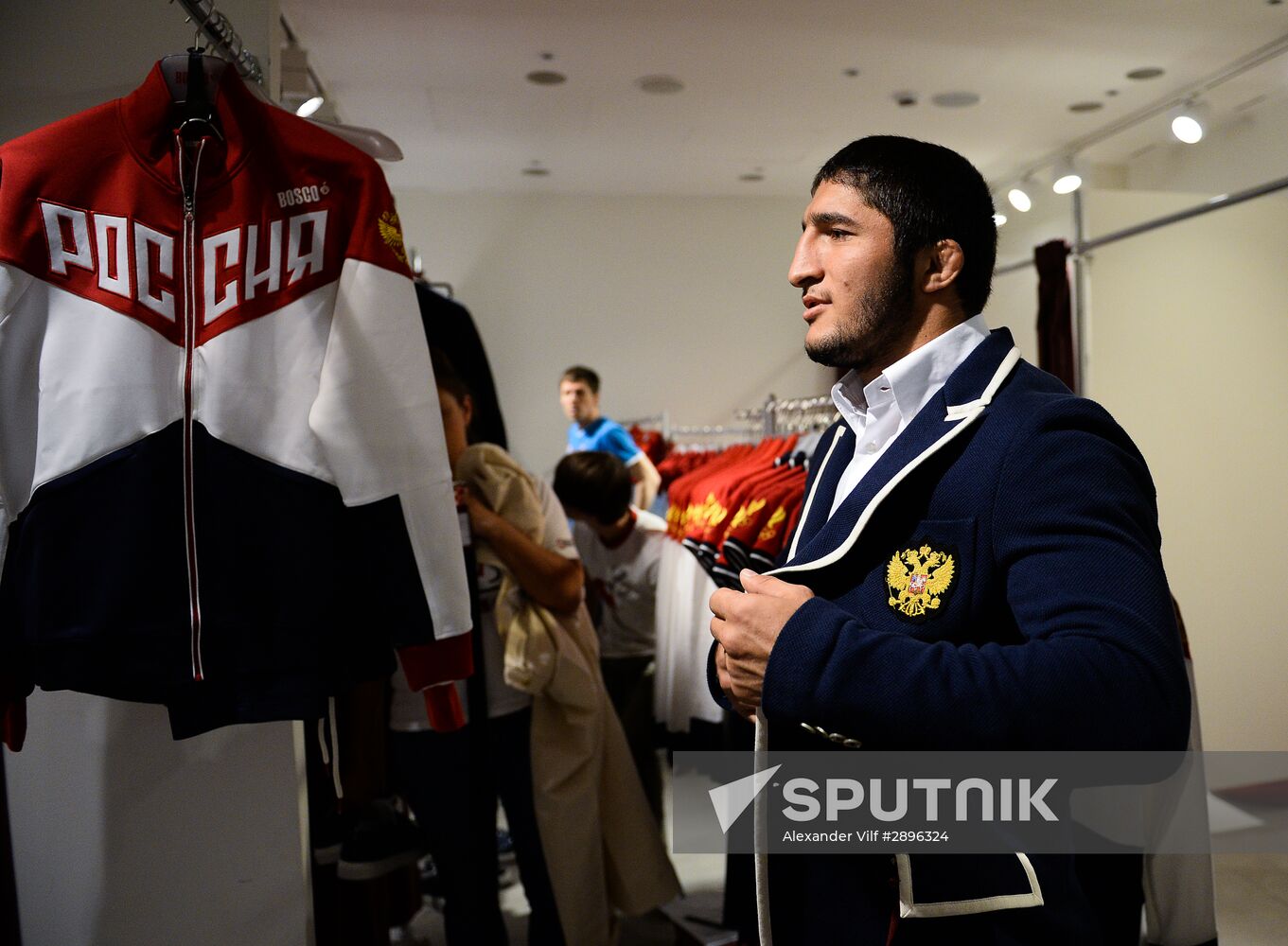 Russian Olympic track and field and freestyle wrestling teams receive outfits for 2016 Olympics