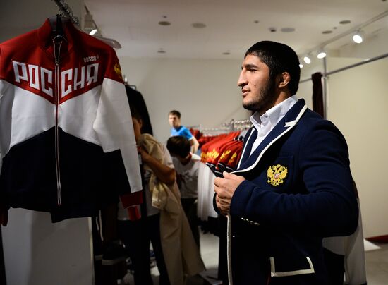 Russian Olympic track and field and freestyle wrestling teams receive outfits for 2016 Olympics