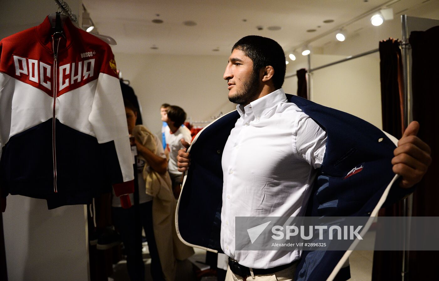 Russian Olympic track and field and freestyle wrestling teams receive outfits for 2016 Olympics