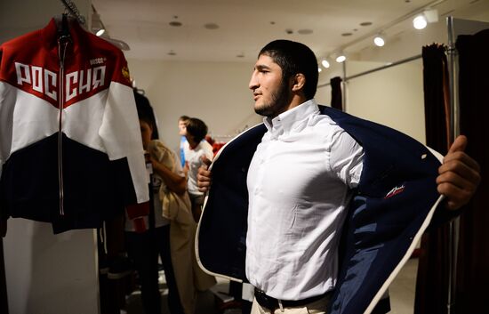 Russian Olympic track and field and freestyle wrestling teams receive outfits for 2016 Olympics