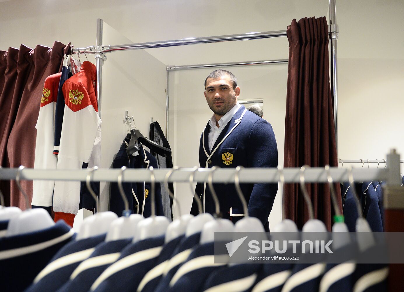 Russian Olympic track and field and freestyle wrestling teams receive outfits for 2016 Olympics