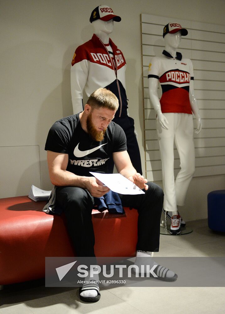 Russian Olympic track and field and freestyle wrestling teams receive outfits for 2016 Olympics