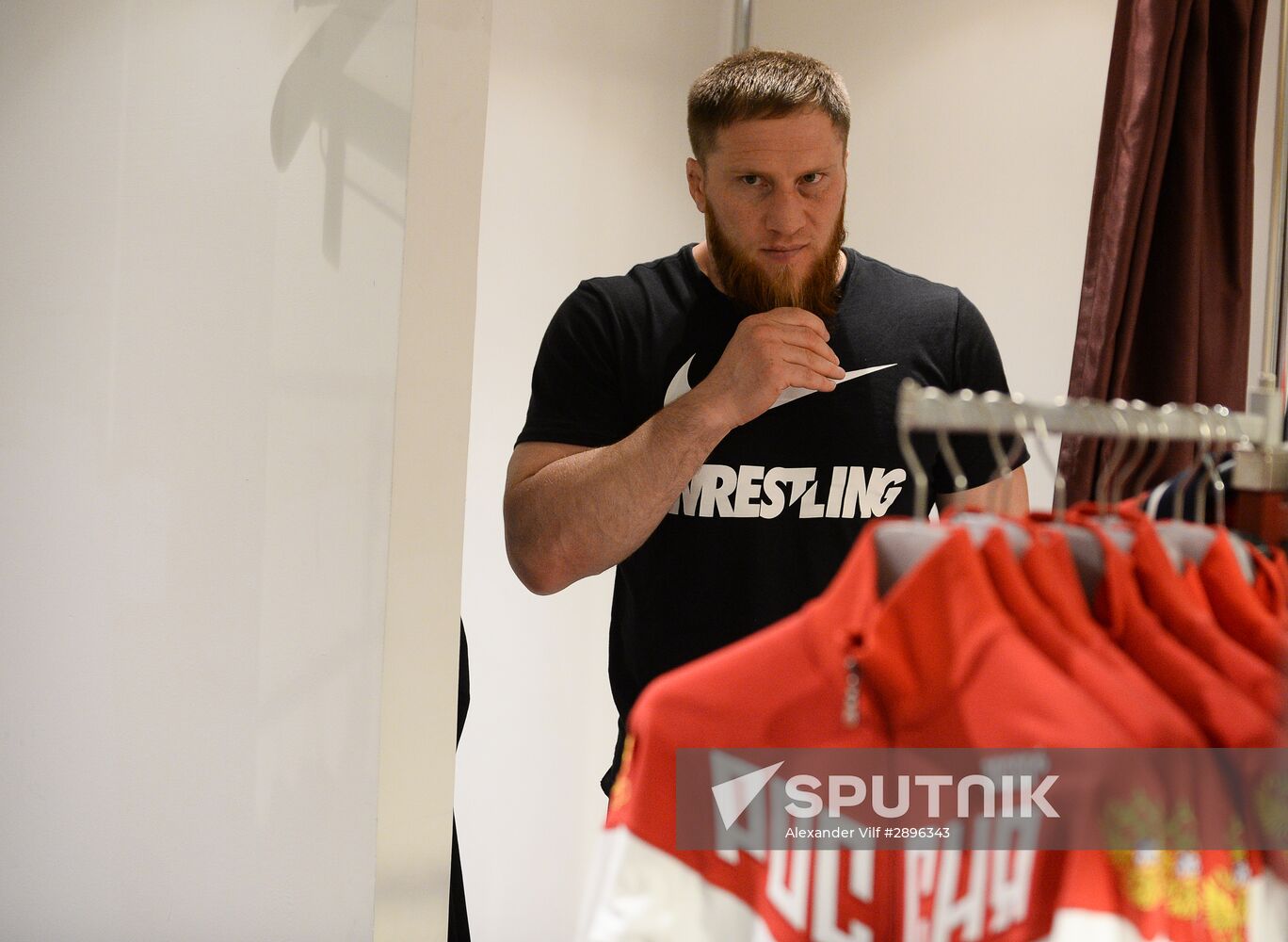 Russian Olympic track and field and freestyle wrestling teams receive outfits for 2016 Olympics