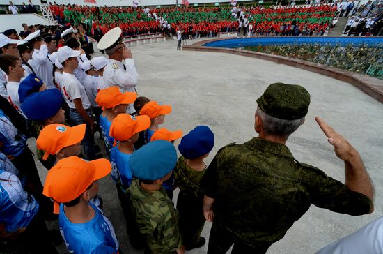 Children at Okean camp take oath