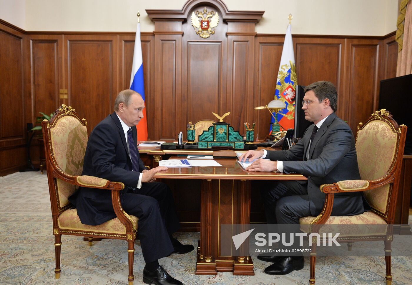 Russian President Vladimir Putin meets with Energy Minister Alexander Novak