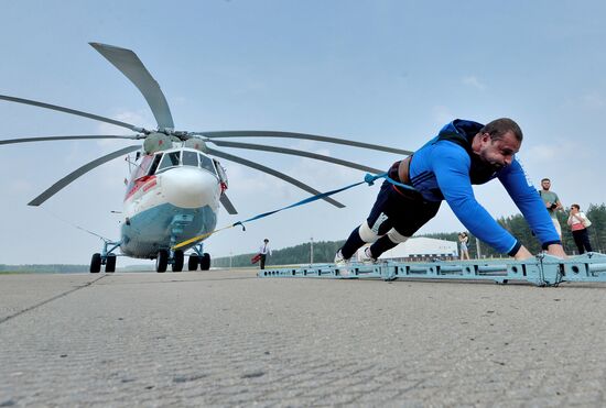 Strongman Kirill Shimko moves helicopter