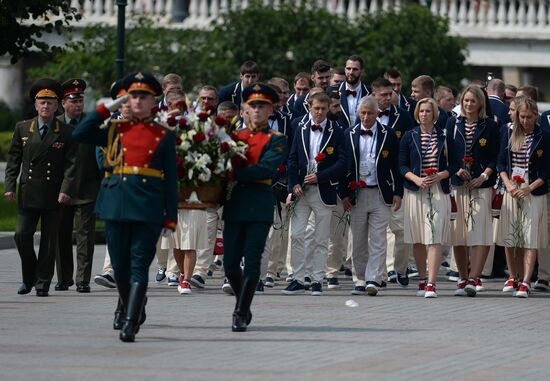 Russian Olympic team lay flowers at Eternal Flame in Alexander Garden