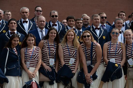 Russian Olympic team lay flowers at Eternal Flame in Alexander Garden