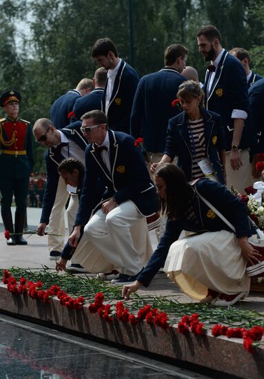 Russia's Olympic team lay flowers at Eternal Flame in Alexander Garden
