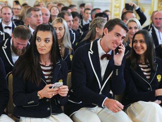 President Vladimir Putin meets with national Olympic team in Kremlin