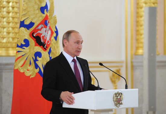 President Vladimir Putin meets with national Olympic team in Kremlin