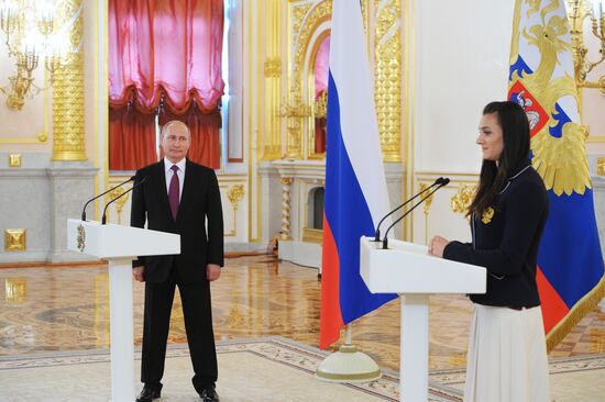President Vladimir Putin meets with national Olympic team in Kremlin