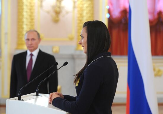 President Vladimir Putin meets with national Olympic team in Kremlin