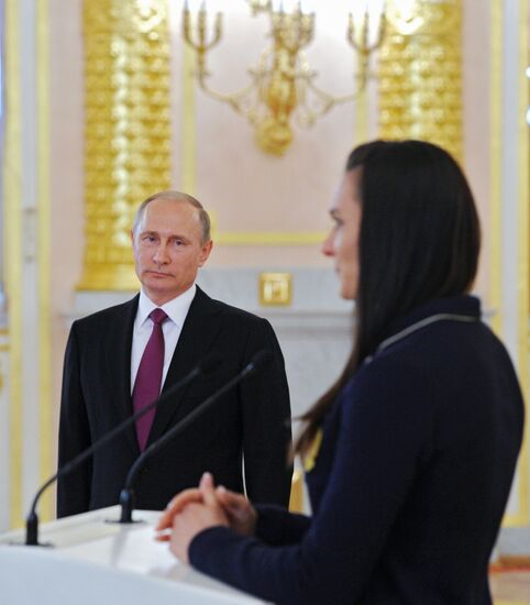 President Vladimir Putin meets with national Olympic team in Kremlin