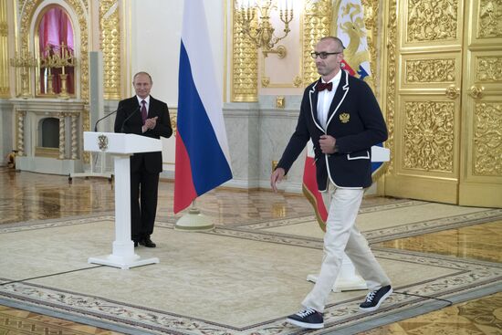 President Vladimir Putin meets with national Olympic team in Kremlin