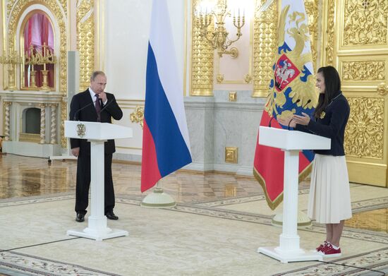 President Vladimir Putin meets with national Olympic team in Kremlin