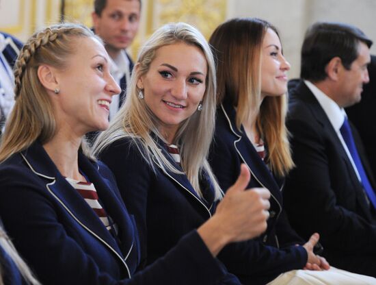 President Vladimir Putin meets with national Olympic team in Kremlin