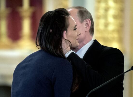 President Vladimir Putin meets with national Olympic team in Kremlin