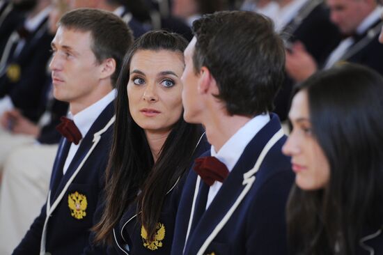 President Vladimir Putin meets with national Olympic team in Kremlin