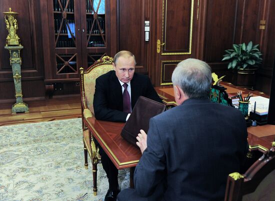 Russian President Vladimir Putin meets with Vladimir Bulavin