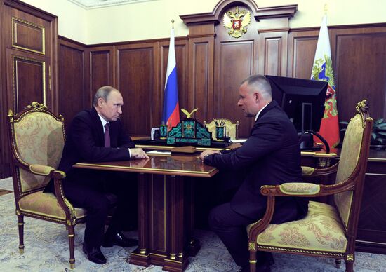 Russian President Vladimir Putin meets with Yevgeny Zinichev